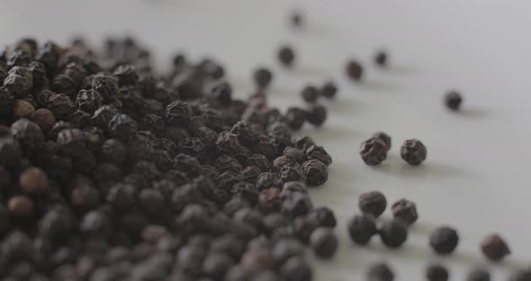 Detail of Peppercorns on a white plate