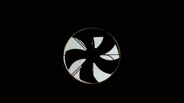 A Hood with a Fan Is Installed in a Dark Room. The Blades Are Spinning