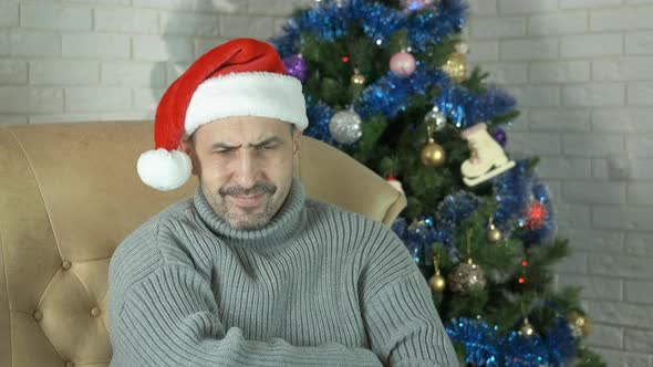 Depressed Man Mood By Christmas Tree