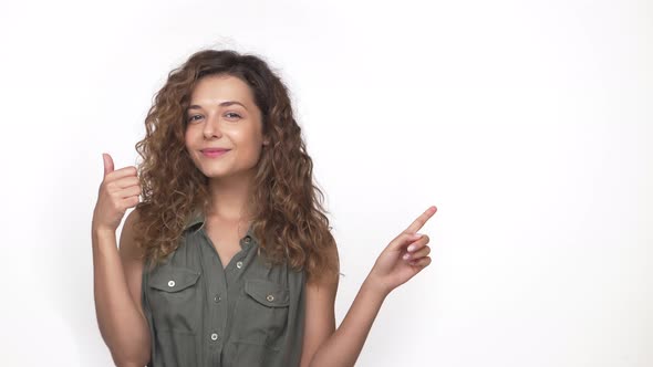 Charming Longhaired Girl Gesturing That Everything is OK with Big Smile Isolated on White Background