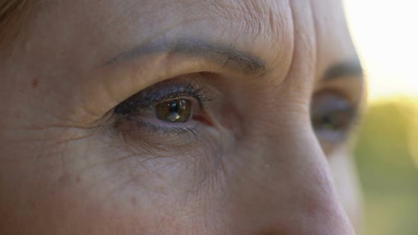 Extreme Close-Up of Mature Woman Eyes, Sad Retired Lady Looking Into Camera