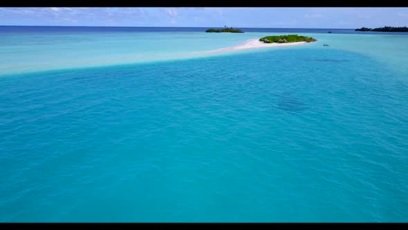 Aerial drone view scenery of beautiful tourist beach wildlife by clear ocean with clean sand backgro