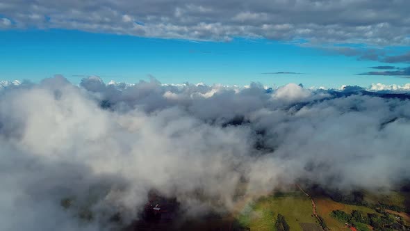 Above the clouds. Sunrise foggy morning.