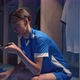 Asian Young Soccer Player Man Talking with Phone Sitting in the Locker Room at the Gym or Stadium - VideoHive Item for Sale