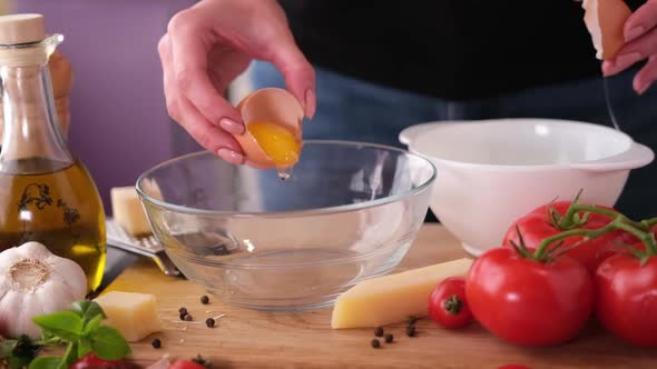 Making Pasta Carbonara  Pouring Crushed Egg Yolk Into Glass Bowl