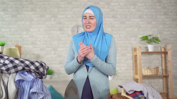 Young Muslim Woman National Headscarf Is Engaged Ironing Burns Her Finger