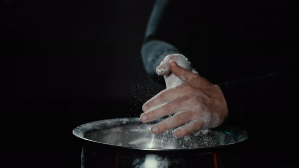 Man Wipes and Claps His Hands with White Magnesia and Talc in Gym so As Not Slip