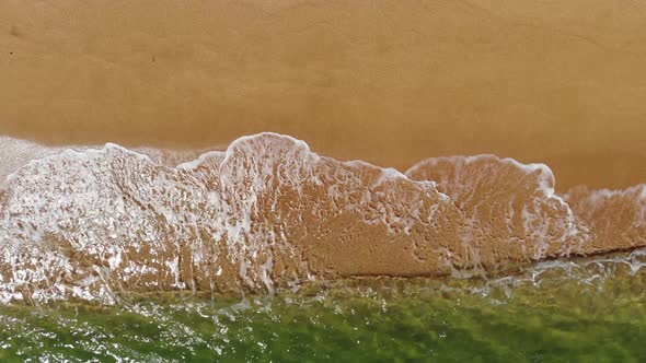 Aerial Top View of Ocean Blue Waves Crashing on the Beach