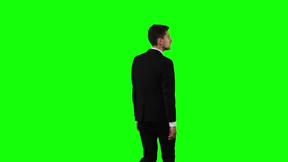 Man Is Going To a Business Meeting and Waving Greetings. Green Screen