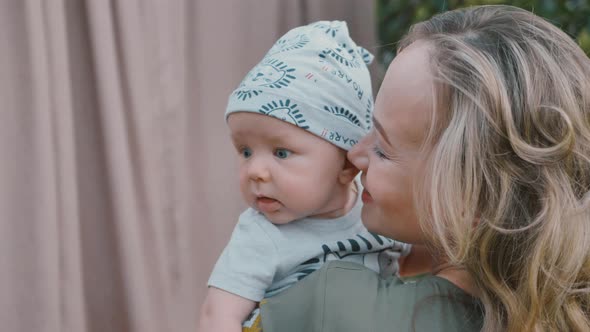 Loving Happy Tender Mom Holding Adorable Cute Baby Boy Hugging Little Baby