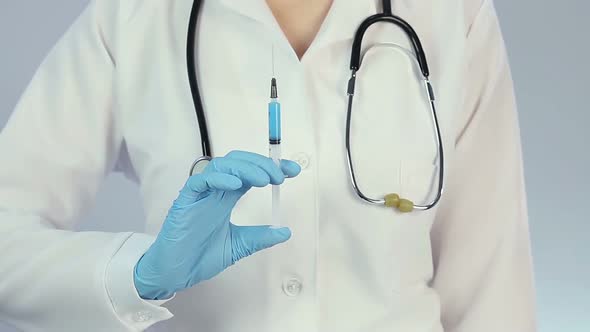 Professional Doctor With Syringe Making Thumbs Up Hand Sign Before Vaccination