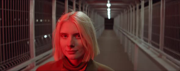 Portrait of Young Woman in Red Light