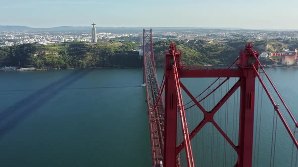Aerial View of a Red Suspension Bridge Across the Tagus River