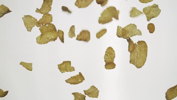 Corn flakes fall in slow motion 100 fps
