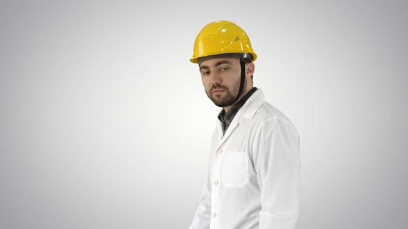 Unhappy construction site engineer talking and walking