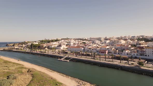 Logos cityscape by the Bensafrim River, Algarve Portugal. Aerial forward