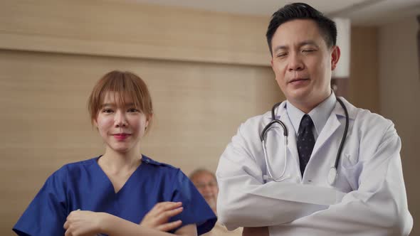 Portrait of Asian group of doctor and nurse remove protective surgical mask after cure covid virus.