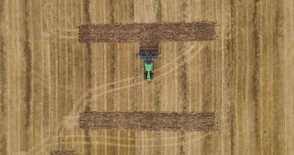 Tractor Makes An Inscription In The Field. Plow