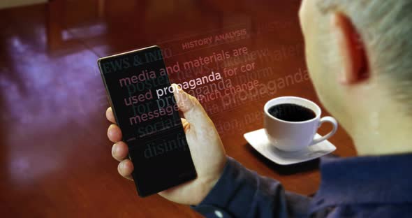 News titles on smartphone screen in hand with propaganda