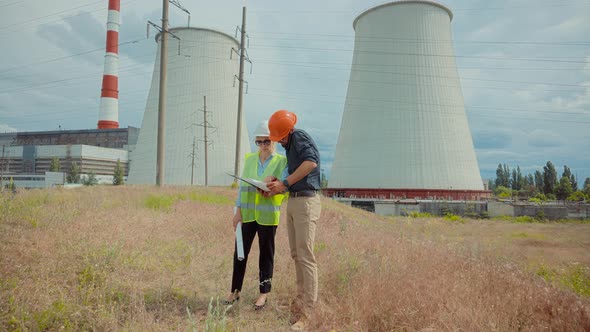 Power Engineer On Electricity Towers High Voltage Pylons.Inspect Industrial Emissions