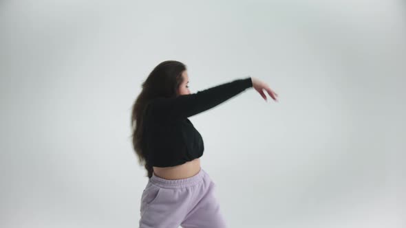 Young Woman Dancing on Cyclorama