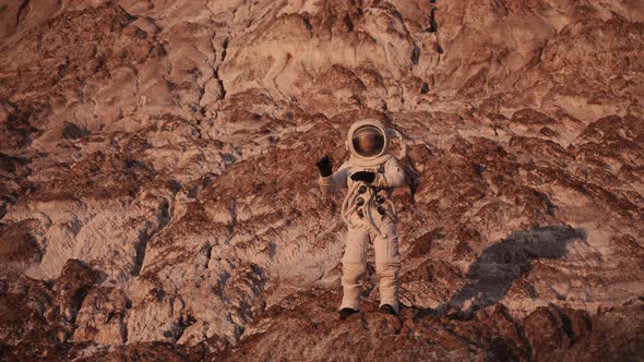 Astronaut Dancing Standing on a Rock