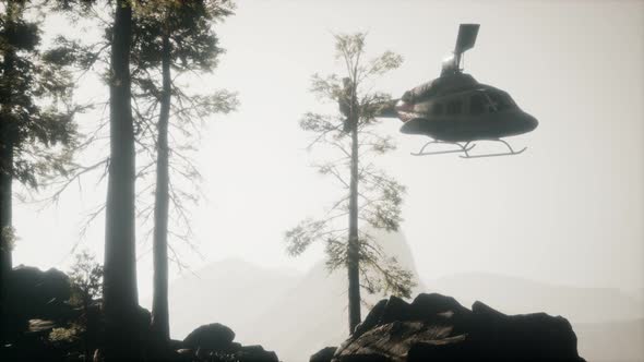 Extreme Slow Motion Flying Helicopter Near Mountain Forest