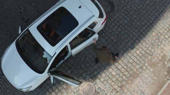 Aerial View of Driver Pulling Criminal Out of Car