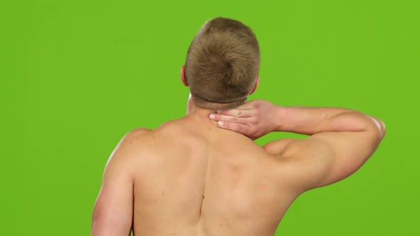 Male Person Rubbing Neck To Relieve Muscular Pain. Green Screen