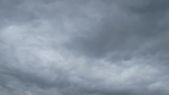 Gray Rain Clouds Are Moving in the Sky. TimeLapse