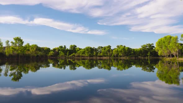 Scenic Lake with Cloud Reflections Zoom Out Timelapse