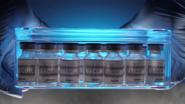 Glass vials for vaccine in laboratory. Group of vaccine bottles. Medicine in ampoules.