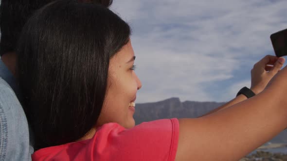 Young couple taking selfies