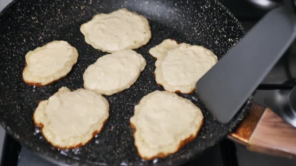 Preparation of Golden Crispy Potato Pancakes in a Frying Pan