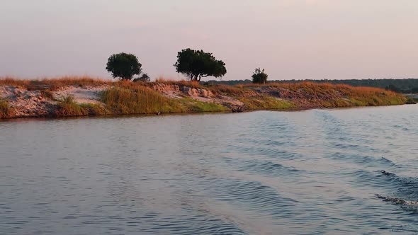 A boat cruise along the Namibia side of the Zambezi river in summer in the Caprivi Strip/Zambezi Reg