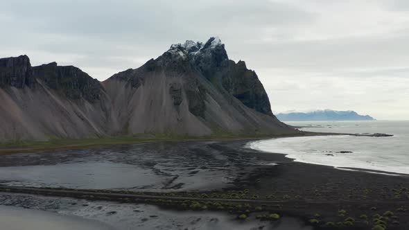 Drone Panning Over Black Sand Beach And Vestrahorn Mountain