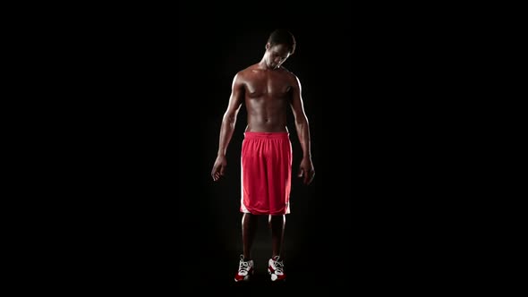 Man Stretching Isolated on Black