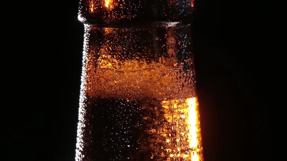 Cold Bottle of Beer on Black Background