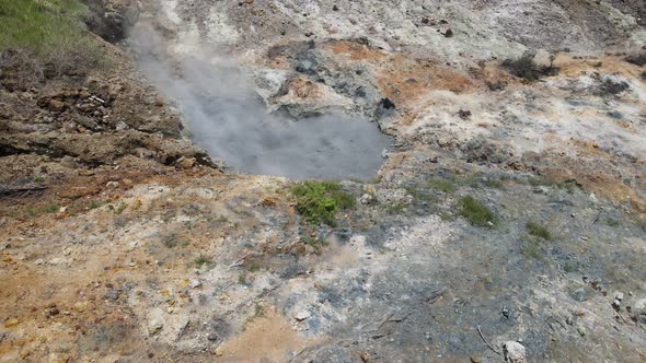 Aerial view of vulcano crater with sulfur vapor coming out of the sulfur marsh.