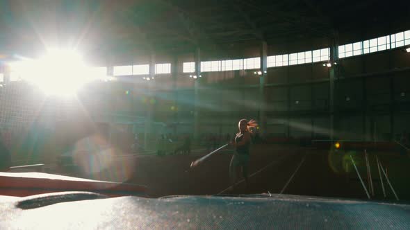 Pole Vaulting - Young Woman Is Running and Jumping Over the Bar