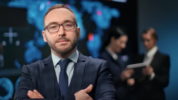 Focused Male Boss Financial Trader at Holographic Informational Chart Board