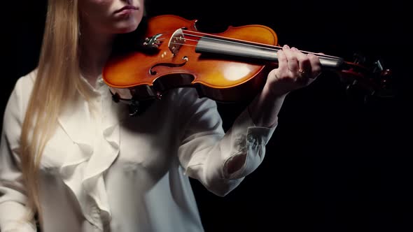 Woman Take Violin in Hand and Start Playing