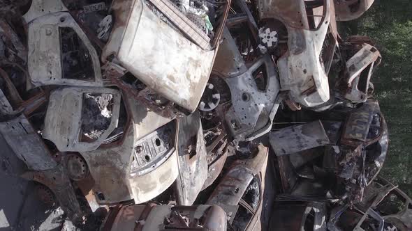 Vertical Video of a Dump of Wardestroyed Cars in Ukraine