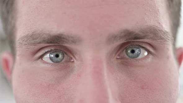 Close Up of Blinking Eyes of Young Man