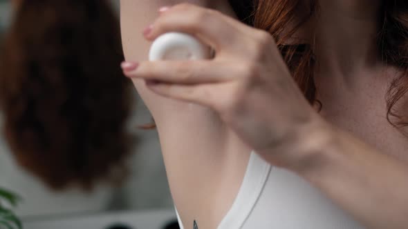 Close up of woman with applying antiperspirant. Shot with RED helium camera in 4K.