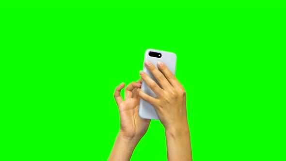 Hands Are Using White Smartphone, Green Screen Background