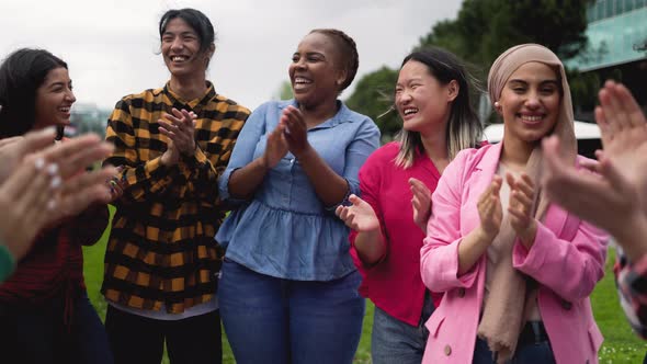 Young multiracial community of friends having fun together outdoor