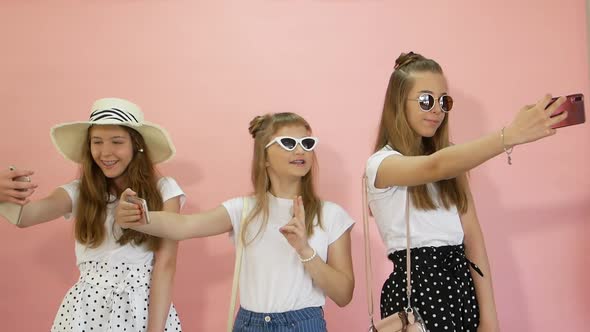 Teen Girls with Smartphone Taking Selfie at Home