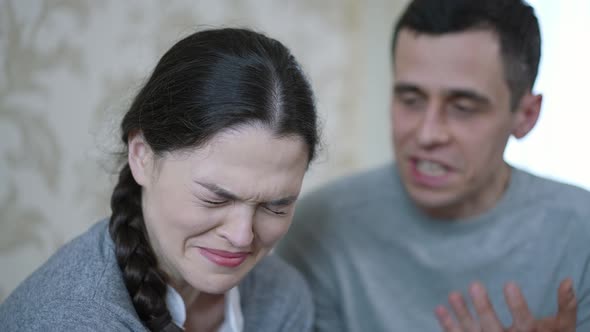 A Man Yells at a Woman Who Is Crying