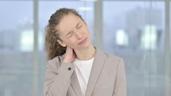 Portrait of Tired Young Businesswoman Having Neck Pain